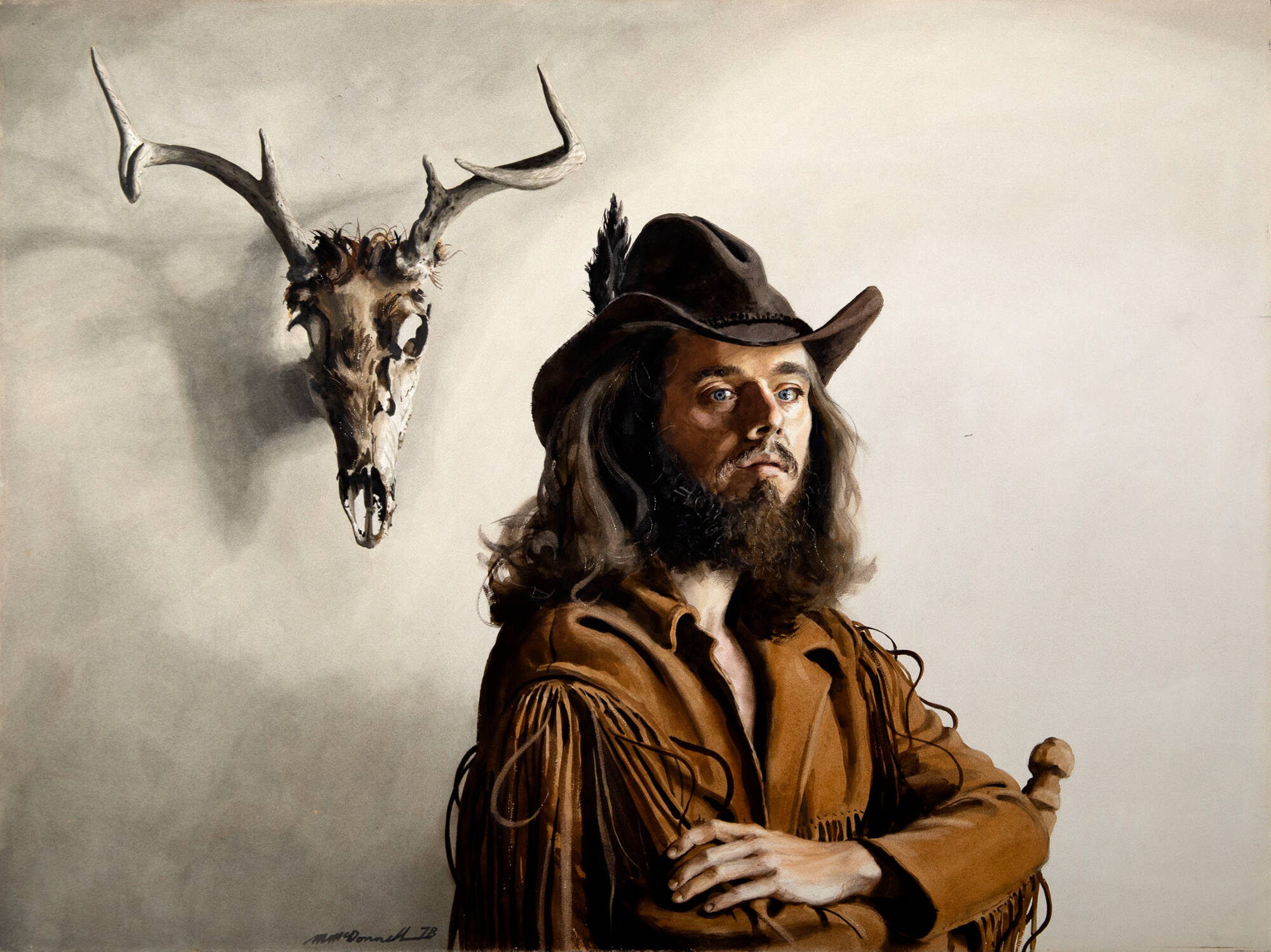 Portrait of a bearded man wearing a leather jacket and hat with a skull with antlers behind him